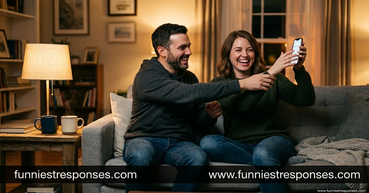 Two friends on a couch, one reaching for the other's phone playfully