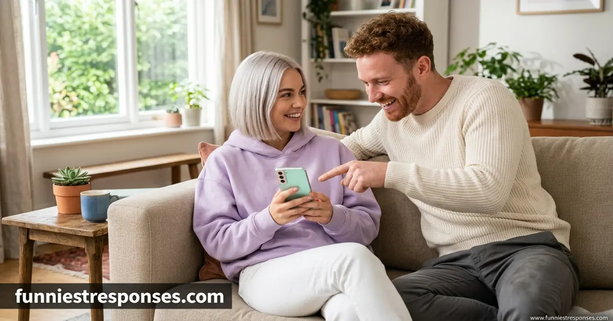 Couple laughing together while looking at a phone